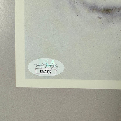 Close-up of authentication sticker on poster, "ZZ49377"