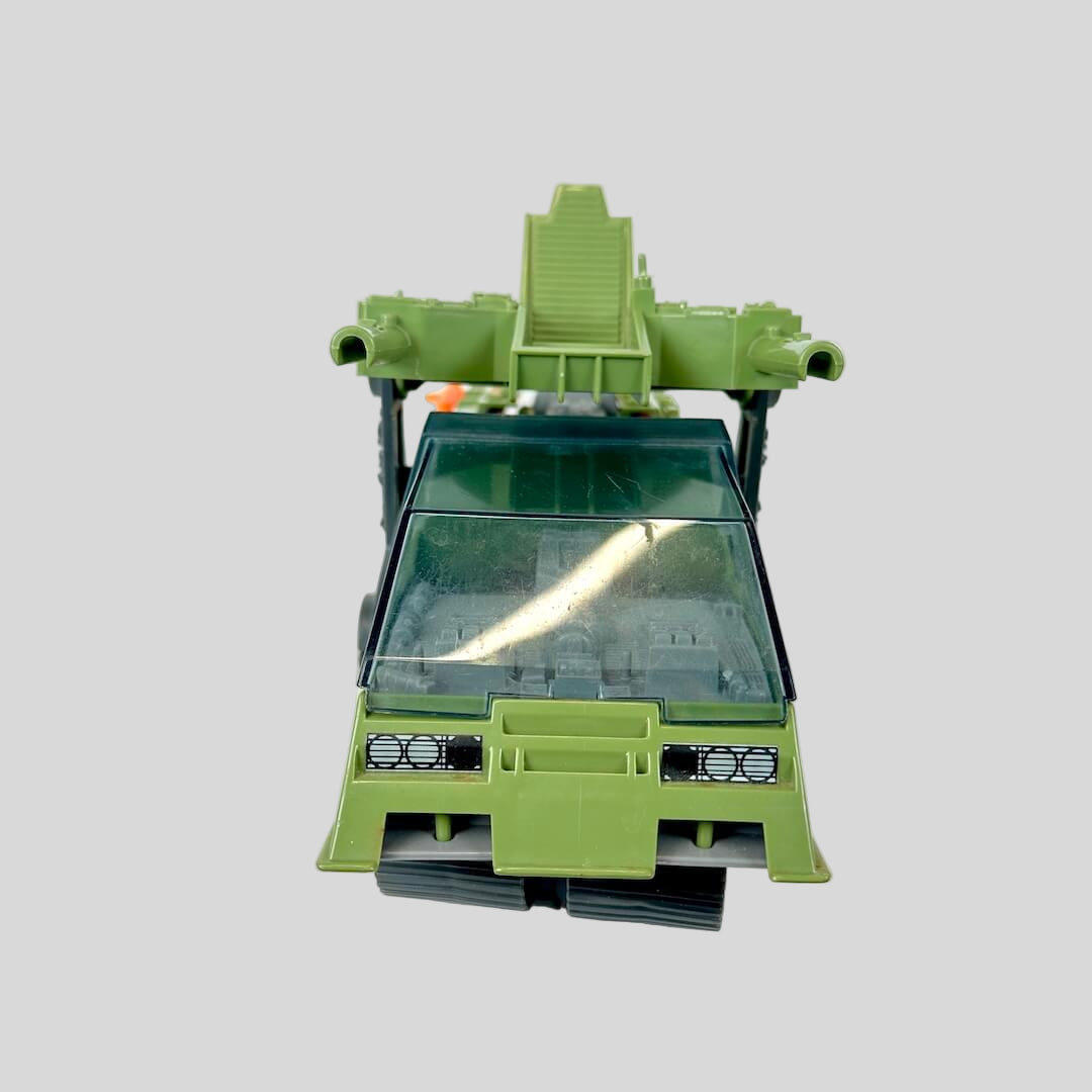 Green toy vehicle on a white background