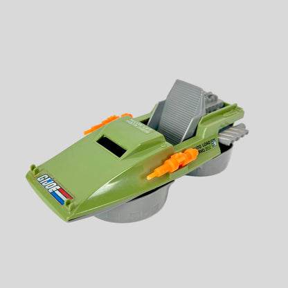 Toy vehicle with green body, gray top, and orange accents on a white background