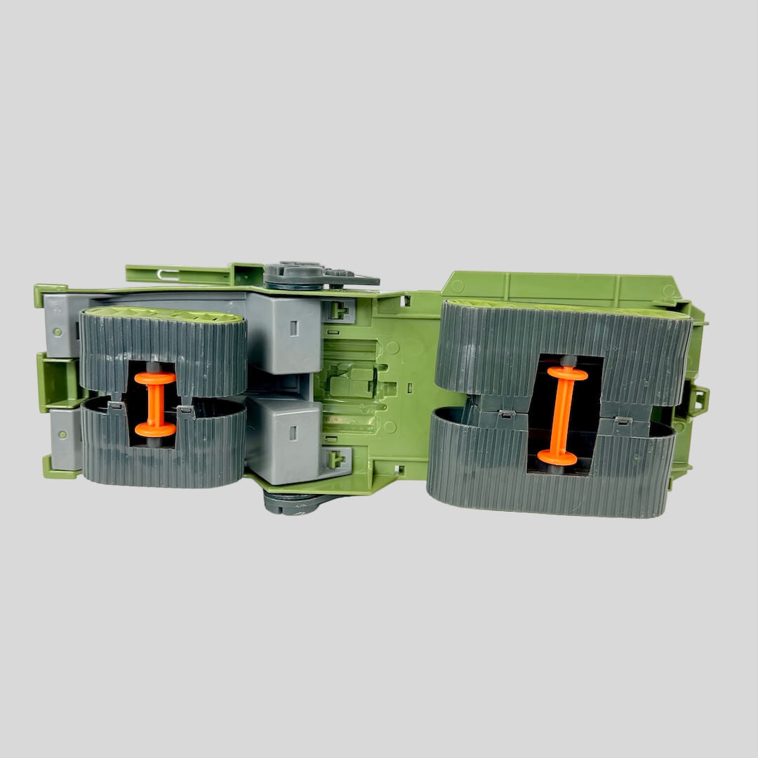 Green and gray mechanical device with orange components on a white background
