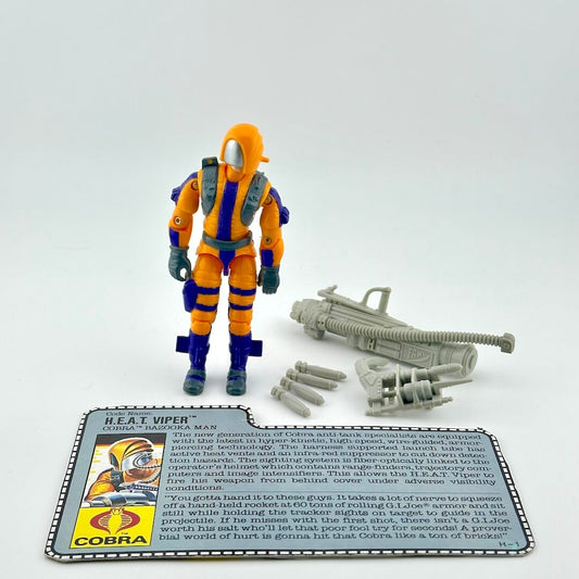 GI Joe action figure with accessories and character card against white background. 