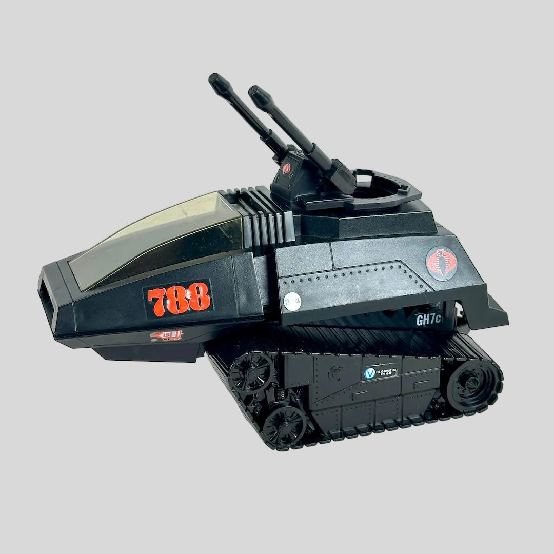 A black toy tank vehicle with red '788' markings and a circular red logo on the side, photographed on a plain background.