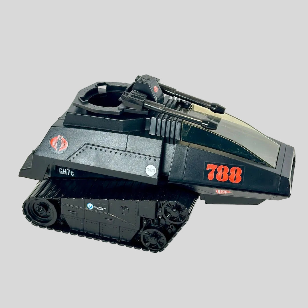 A black toy tank vehicle with red '788' markings and a small roundel emblem, photographed on a plain light background.