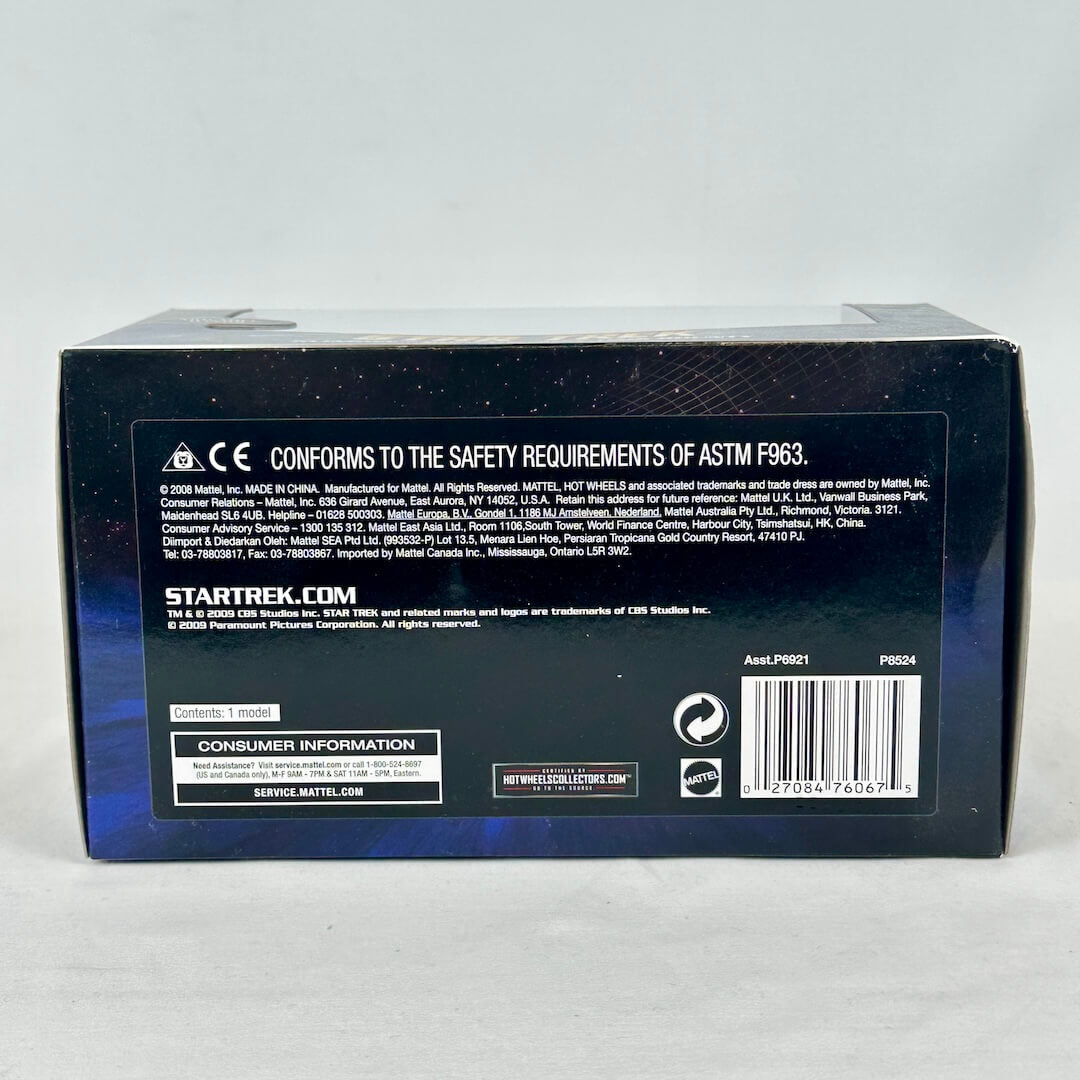 Back of a Star Trek toy box with branding and product information on a gray background