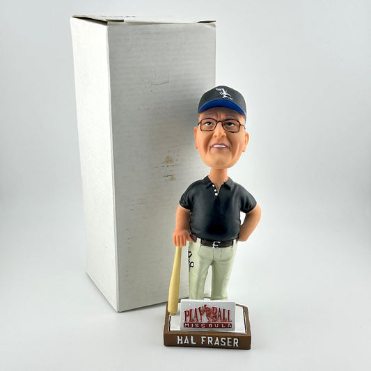 Bobblehead figure of a man with a bat and cap, standing in front of a branded box.