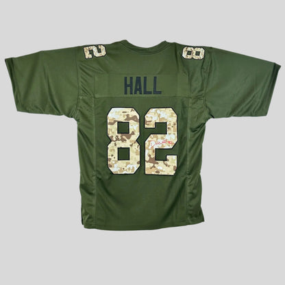 Green sports jersey with 'HALL' and camo number '82' on a gray background