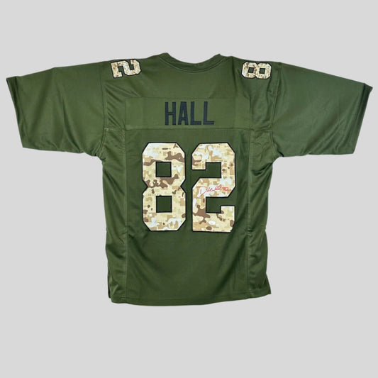Green sports jersey with 'HALL' and camo number '82' on a gray background