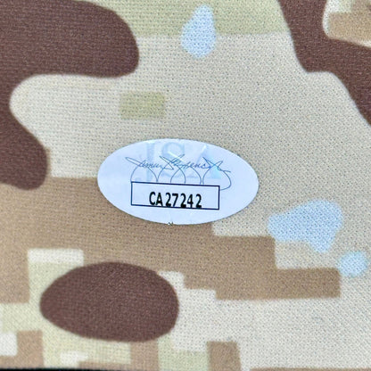 Camouflage fabric with a label and product number on a white background