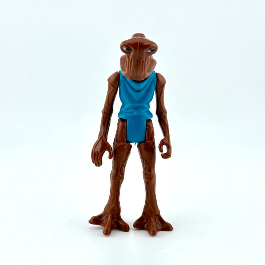 Toy figure with brown skin and blue garment on a white background