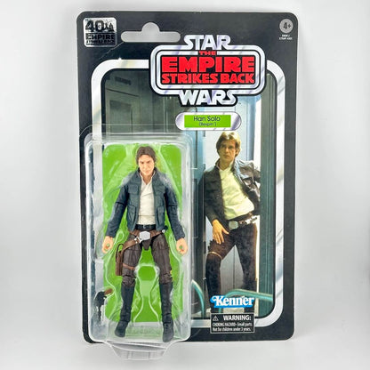 Star Wars action figure in original blister packaging, figure in brown pants and blue jacket with accessory. 