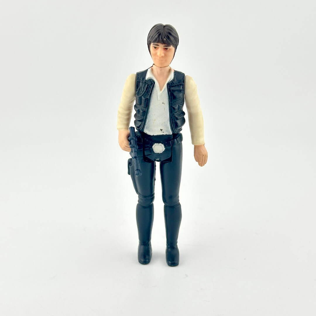 Action figure wearing a vest and pants on a white background