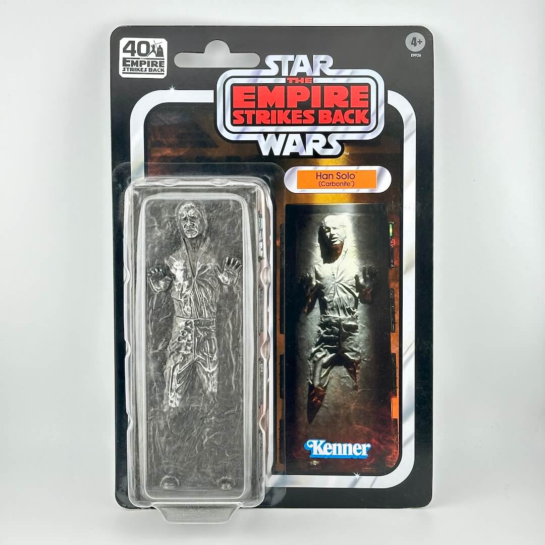 Star Wars action figure in its original blister packaging with retro-style card back; figure is Han trapped in carbonite.