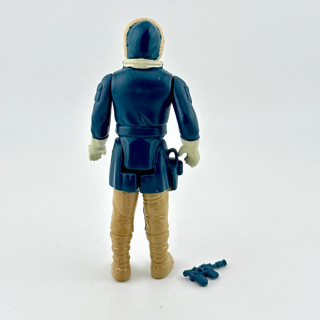 Action figure with blue and beige outfit on a white background