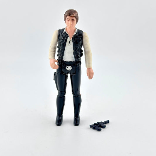 Action figure of a character in a black vest and pants on a white background