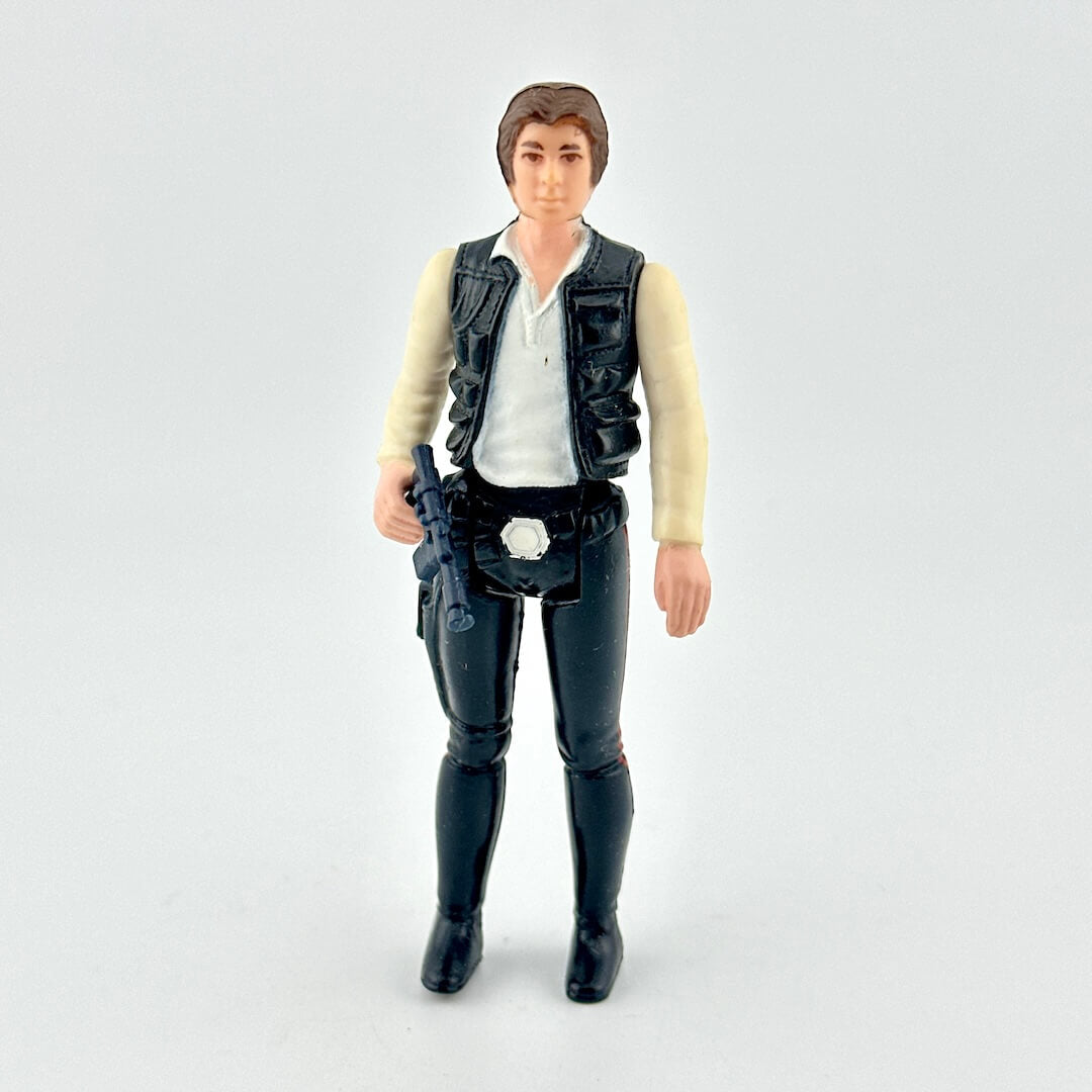 Action figure in a vest and pants on a white background