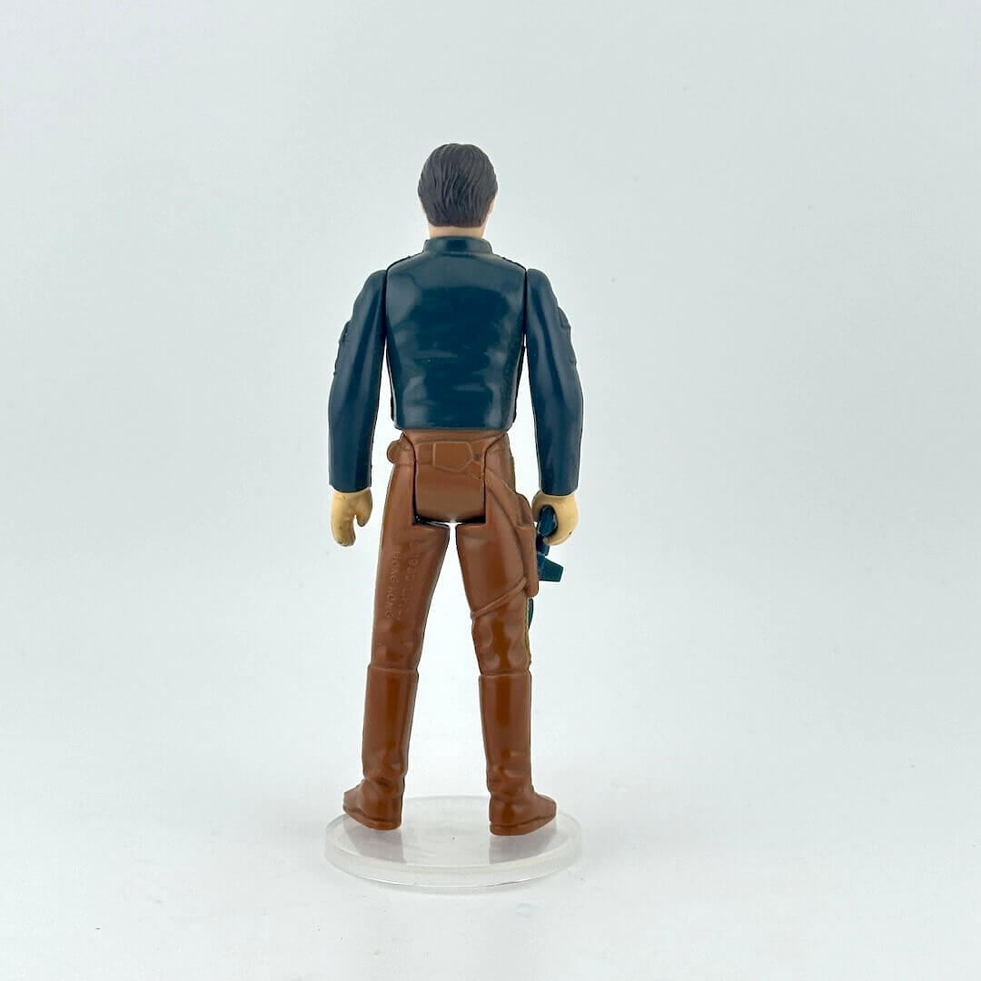 Action figure with a blue jacket and brown pants on a white background