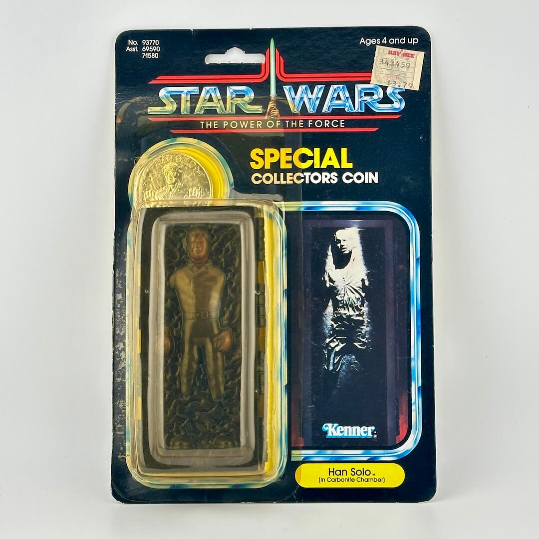 Star Wars Special Collectors Coin packaging with Han Solo figure and gold coin on a white background