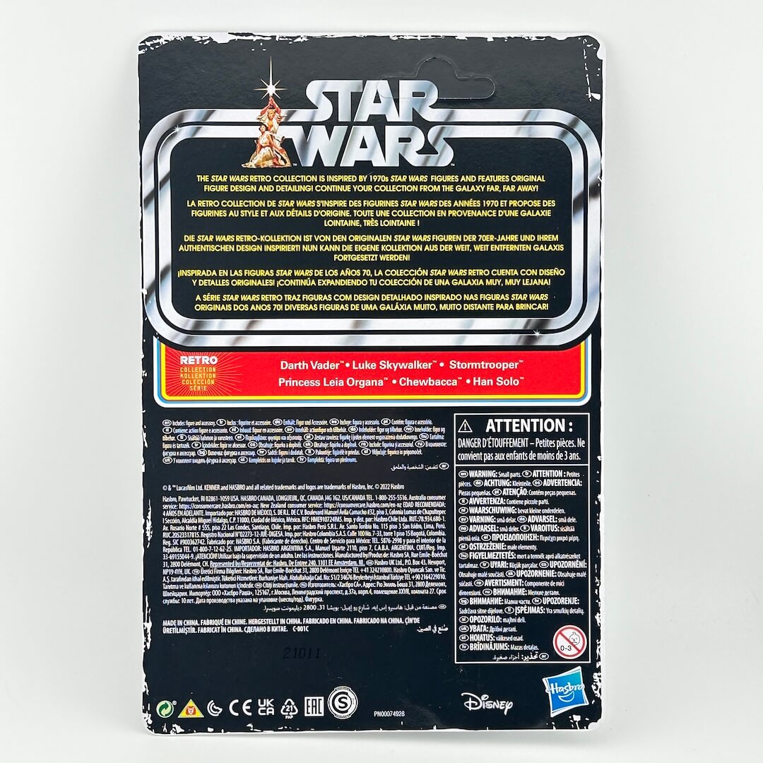 Back of a Star Wars action figure package, featuring character details, & warning labels.