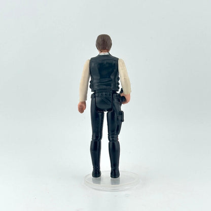 White male action figure in a white shirt, navy vest and pants on a white background