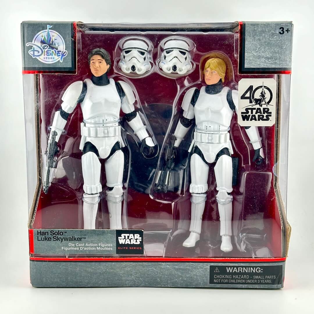 Disney Star Wars Han Solo and Luke Skywalker die-cast action figures in original window box packaging.