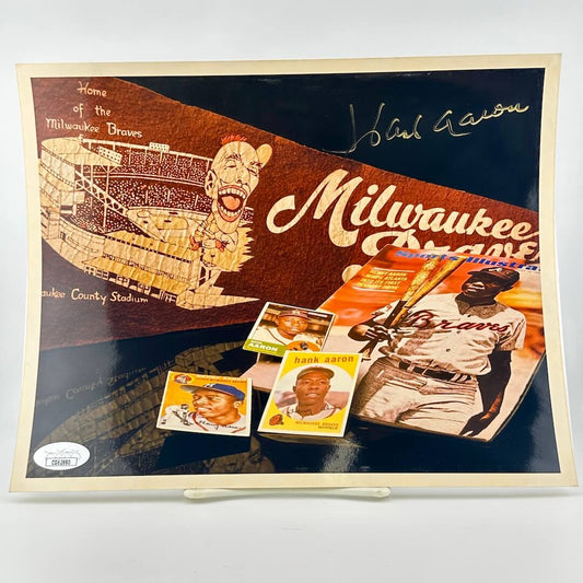 Photograph of memorabilia collage featuring signature of player, JSA authentication sticker in corner. 
