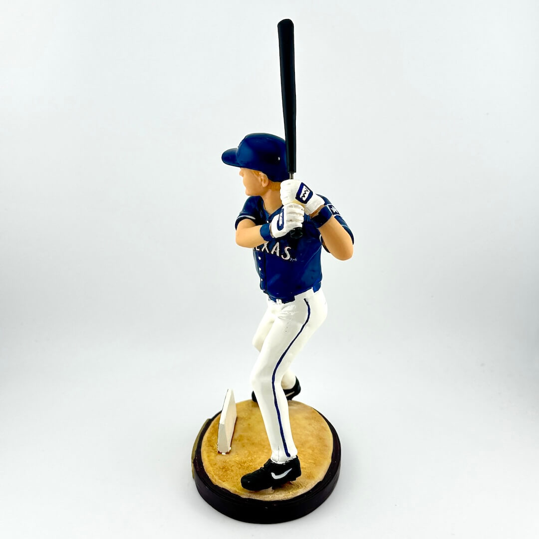 Baseball player figurine in a batting stance on a white background