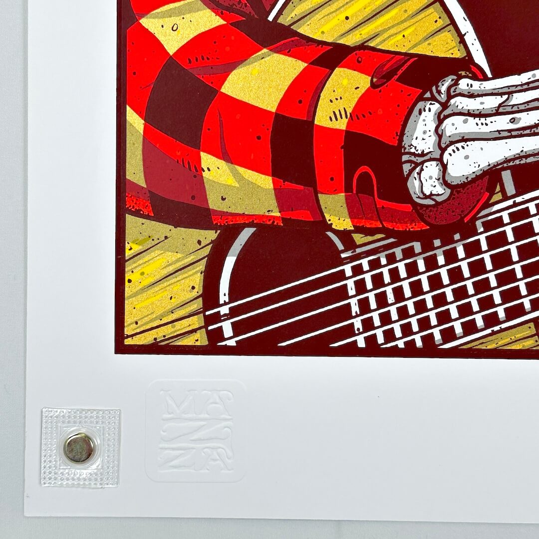 Bottom left corner with embossing visible by magnet holding poster. 