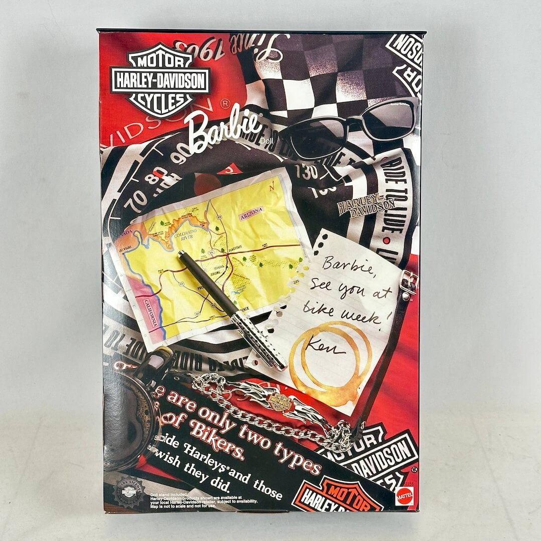 Harley-Davidson and Barbie collaboration packaging with checkered flag, sunglasses, and map.