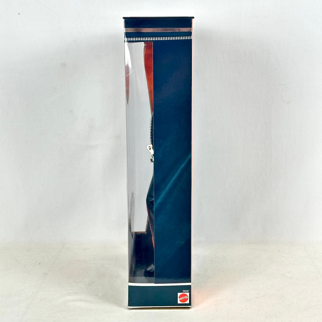 Tall, rectangular box with a reflective surface on a white background