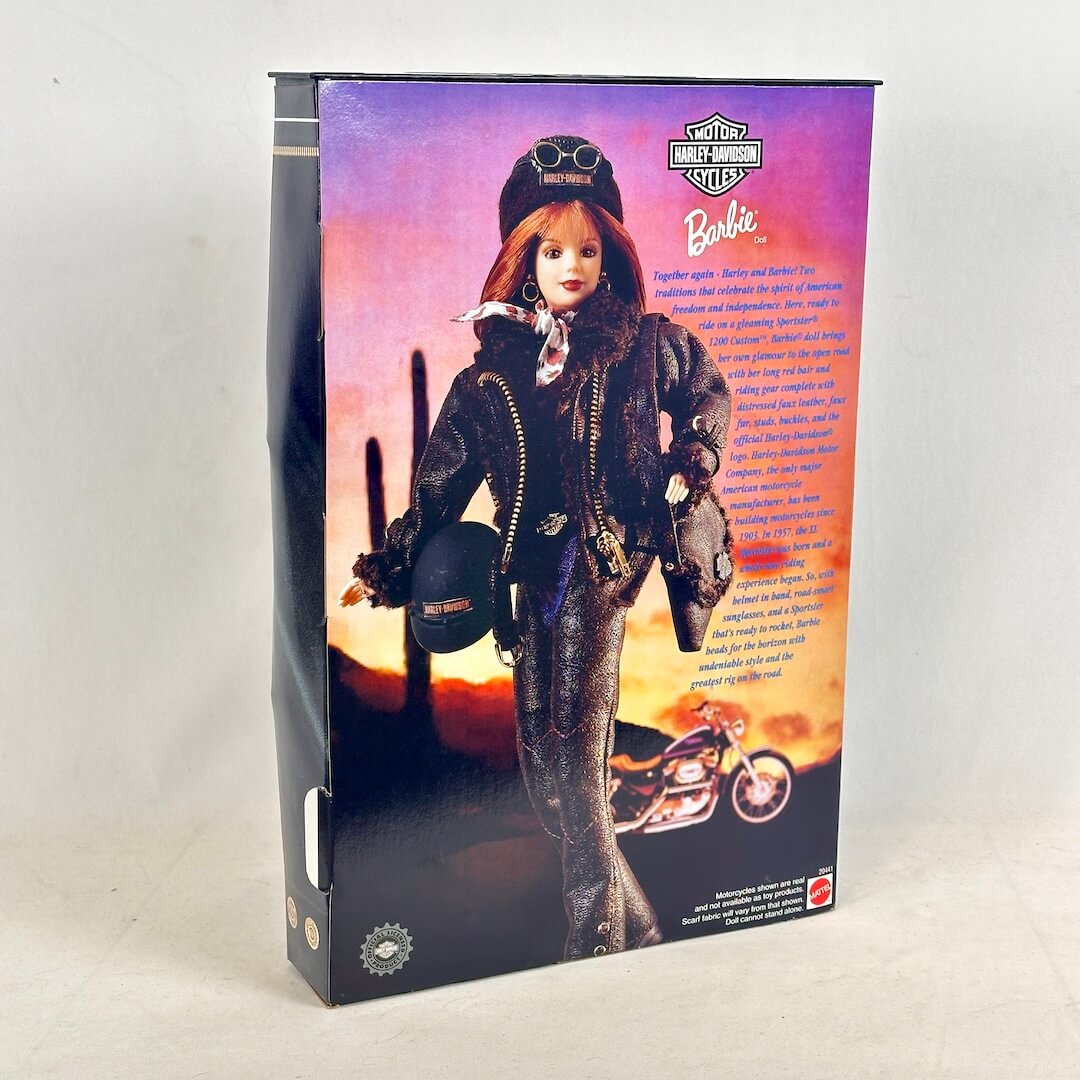 Barbie doll in a motorcycle helmet and jacket with Harley-Davidson branding on packaging