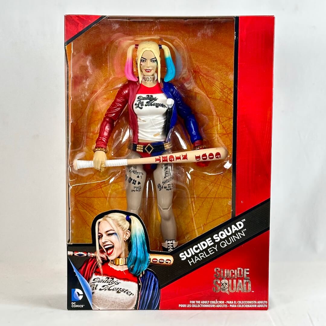 Harley Quinn action figure in packaging with 'Suicide Squad' branding.