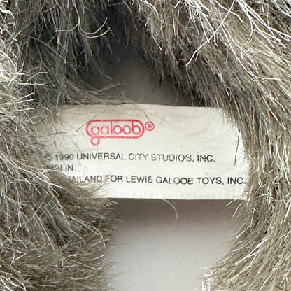 Close-up of a toy label inside a textured object, with 'Galoob' branding visible.