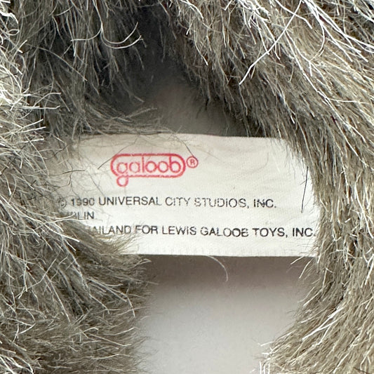 Close-up of a toy label inside a textured object, with 'Galoob' branding visible.