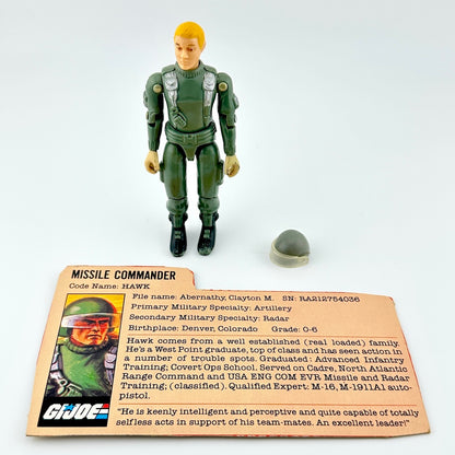 GI Joe action figure with character card and accessories against white background. 