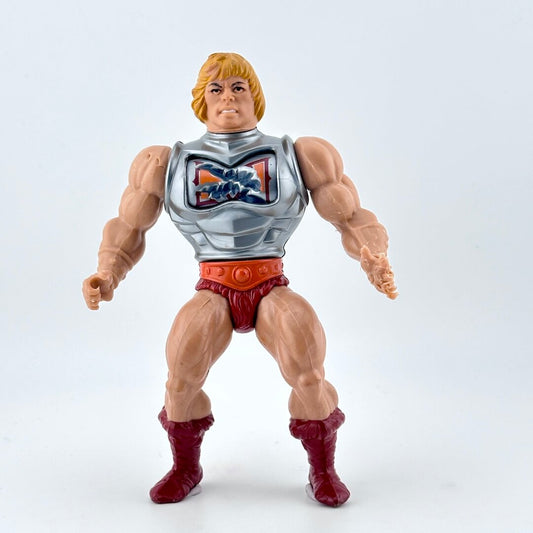 Blonde, white, male, muscled action figure in siler chest armor and red loincloth. 