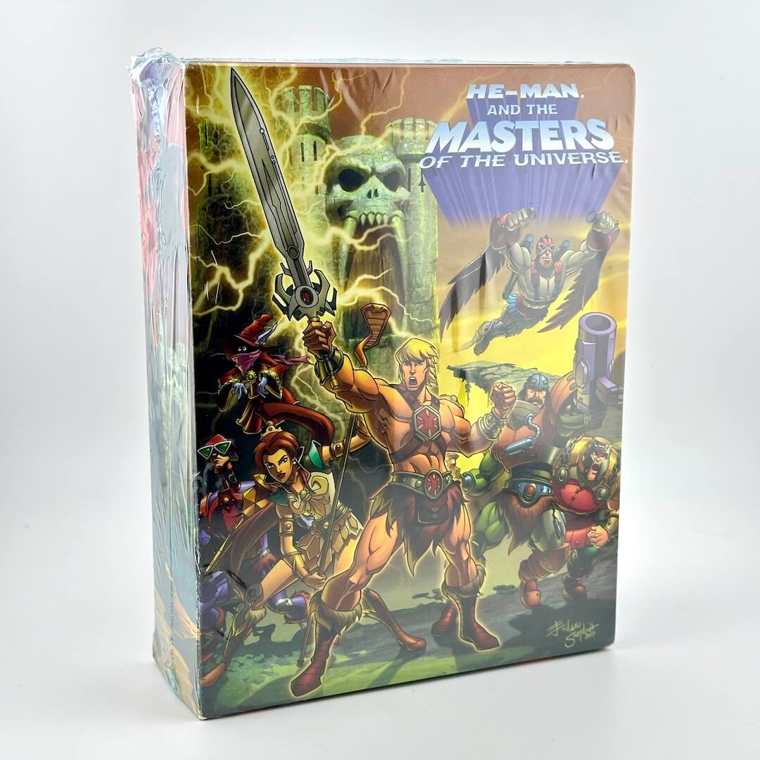 Box for 'He-Man and the Masters of the Universe' featuring characters and a sword.