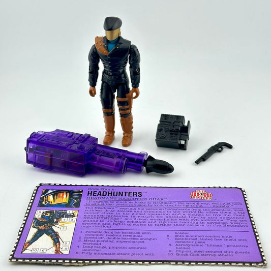 GI Joe action figure with three accessories and character card against white background. 