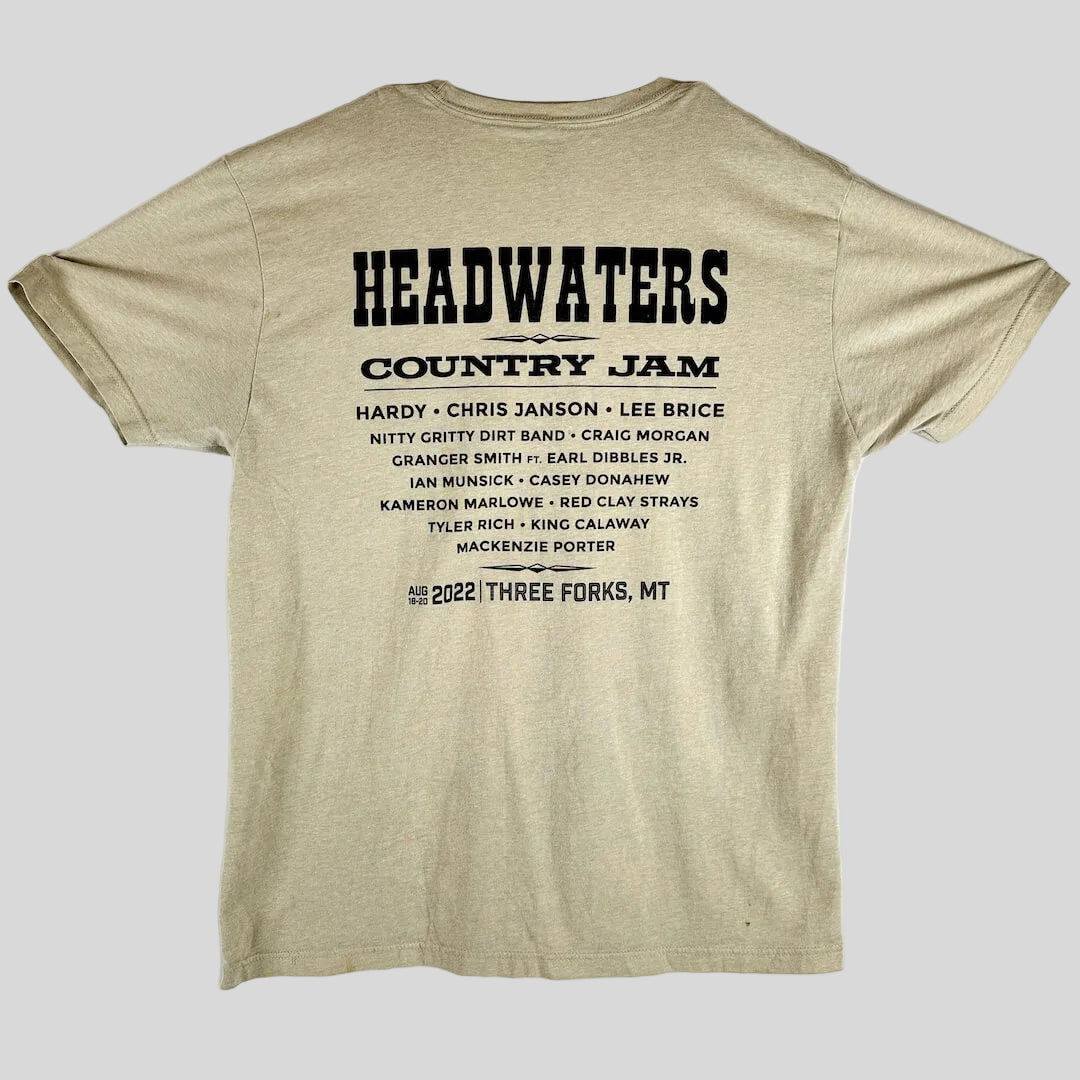 A beige t-shirt back with black text that reads 'HEADWATERS COUNTRY JAM' & a list of performing artists & the date/location.