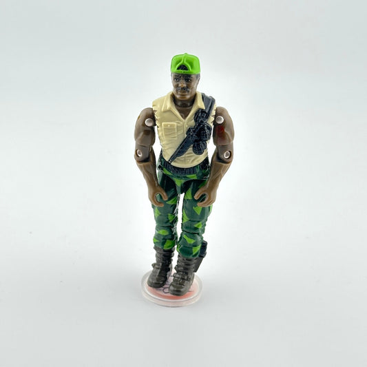 Action figure in military attire with a green cap on a white background