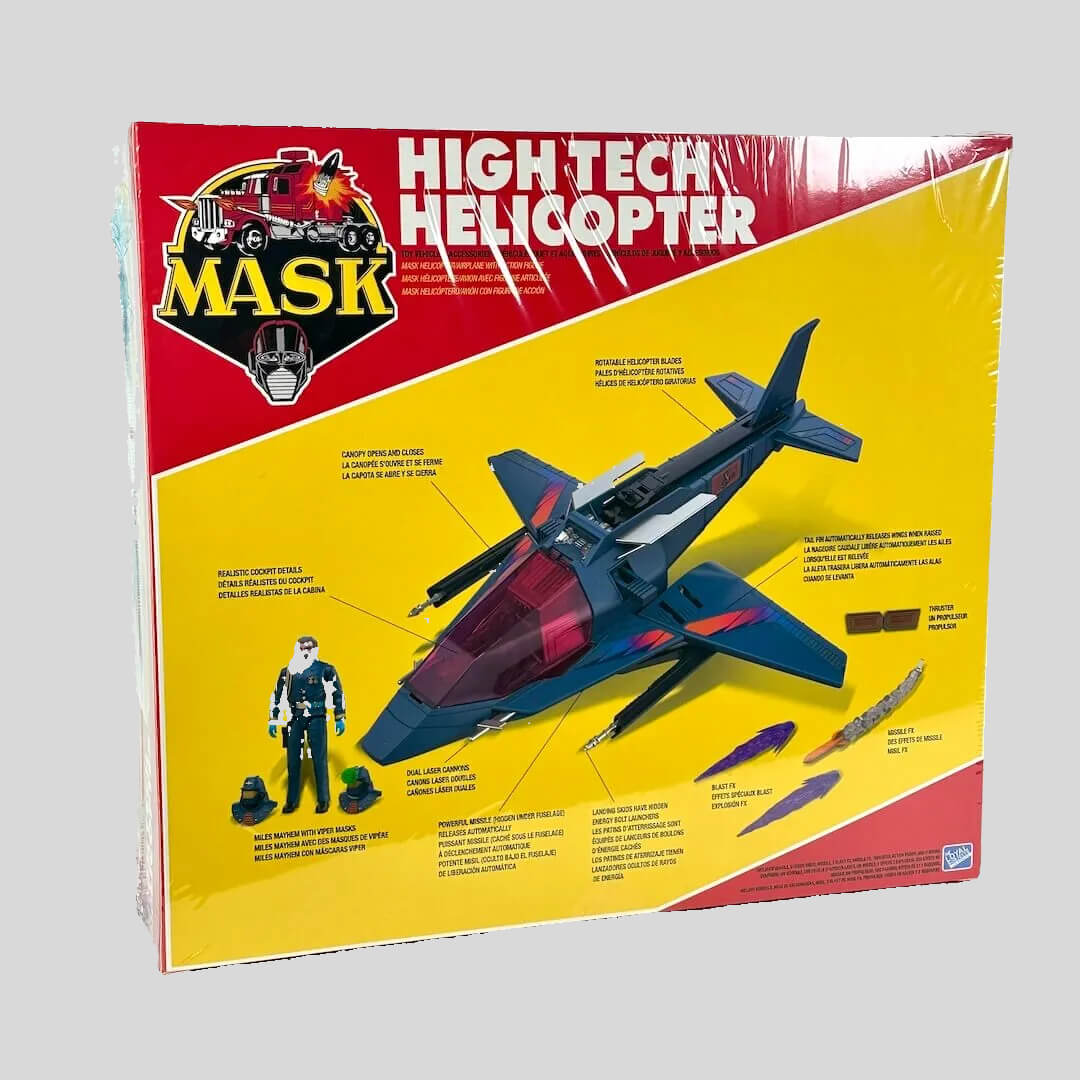 Toy packaging with "MASK" branding against gray background. 