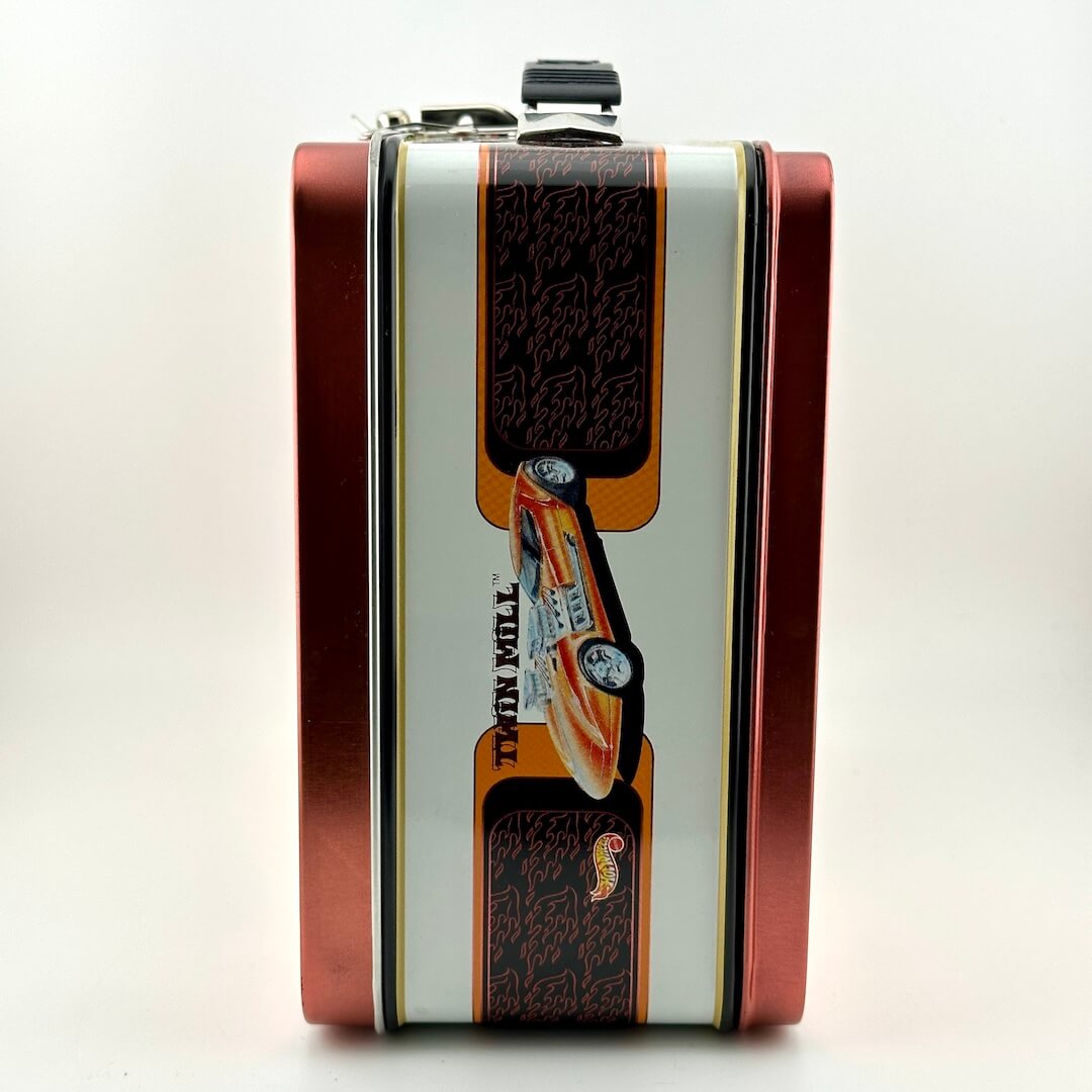 A rectangular metal lunch box with a red side border and a central white panel featuring a printed race car.