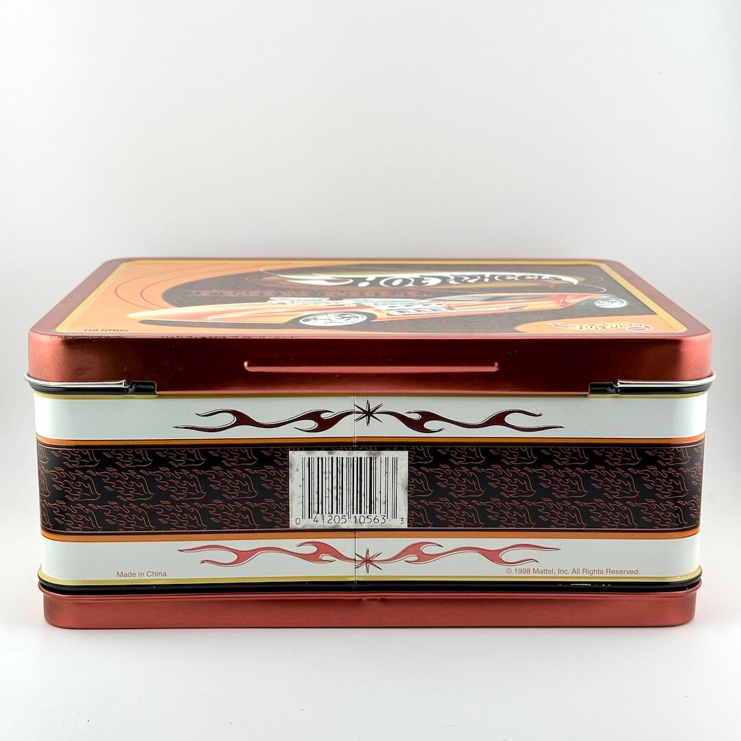 A rectangular Hot Wheels metal tin box with a red and white design, featuring flame patterns and a Hot Wheels logo.