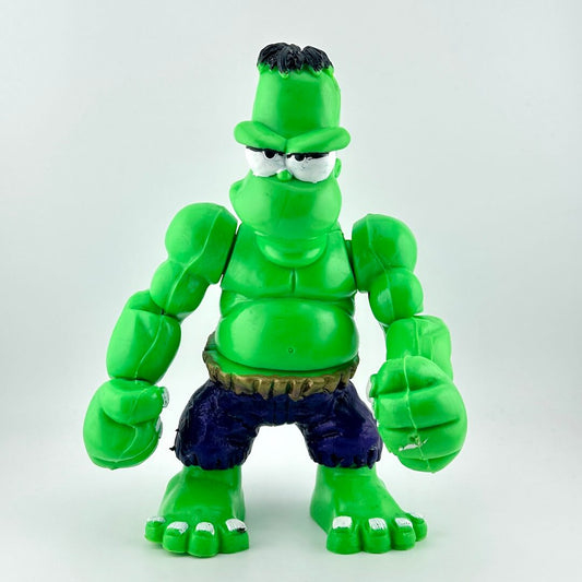 Green superhero action figure with a white background