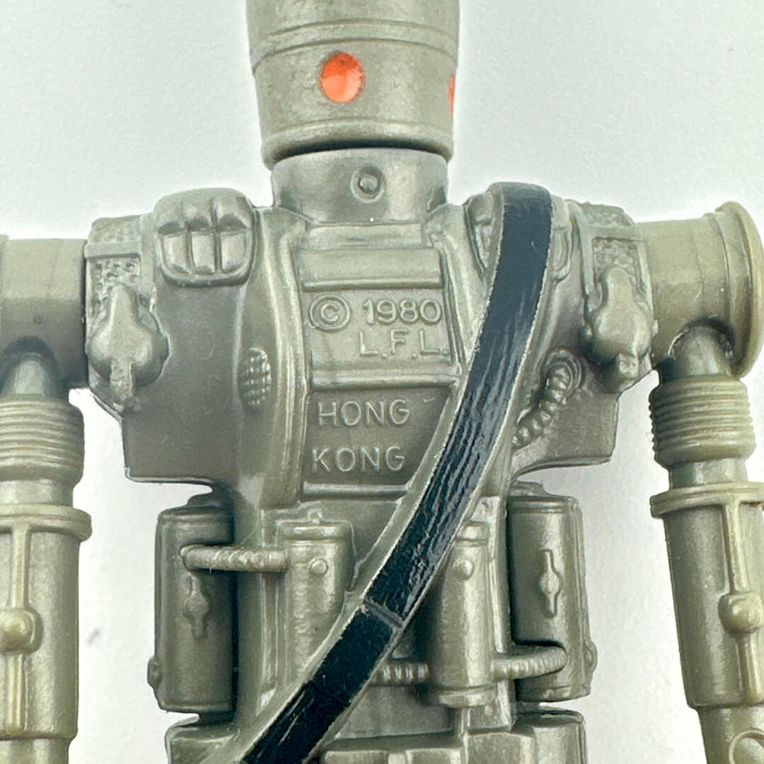 Metallic robot figure with '1980 LFL' and 'Hong Kong' text on a white background