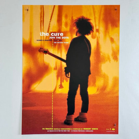 Poster for 'Join the Dots' by The Cure featuring a silhouette of a person with a guitar against an orange background.