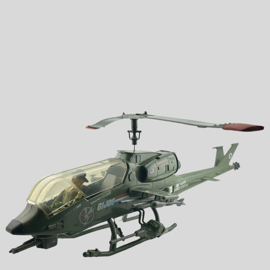Army green helicopter with G.I Joe stickers along the side, contains action figure driver with hat & glasses. 