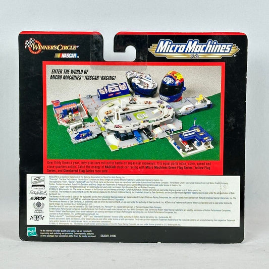 Micro Machines toy packaging with race track and cars on a gray background