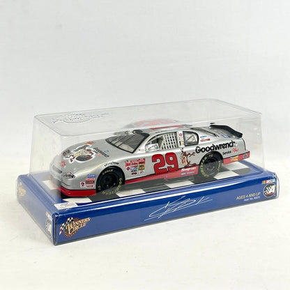 Model car in a clear display case with a blue base on a white background