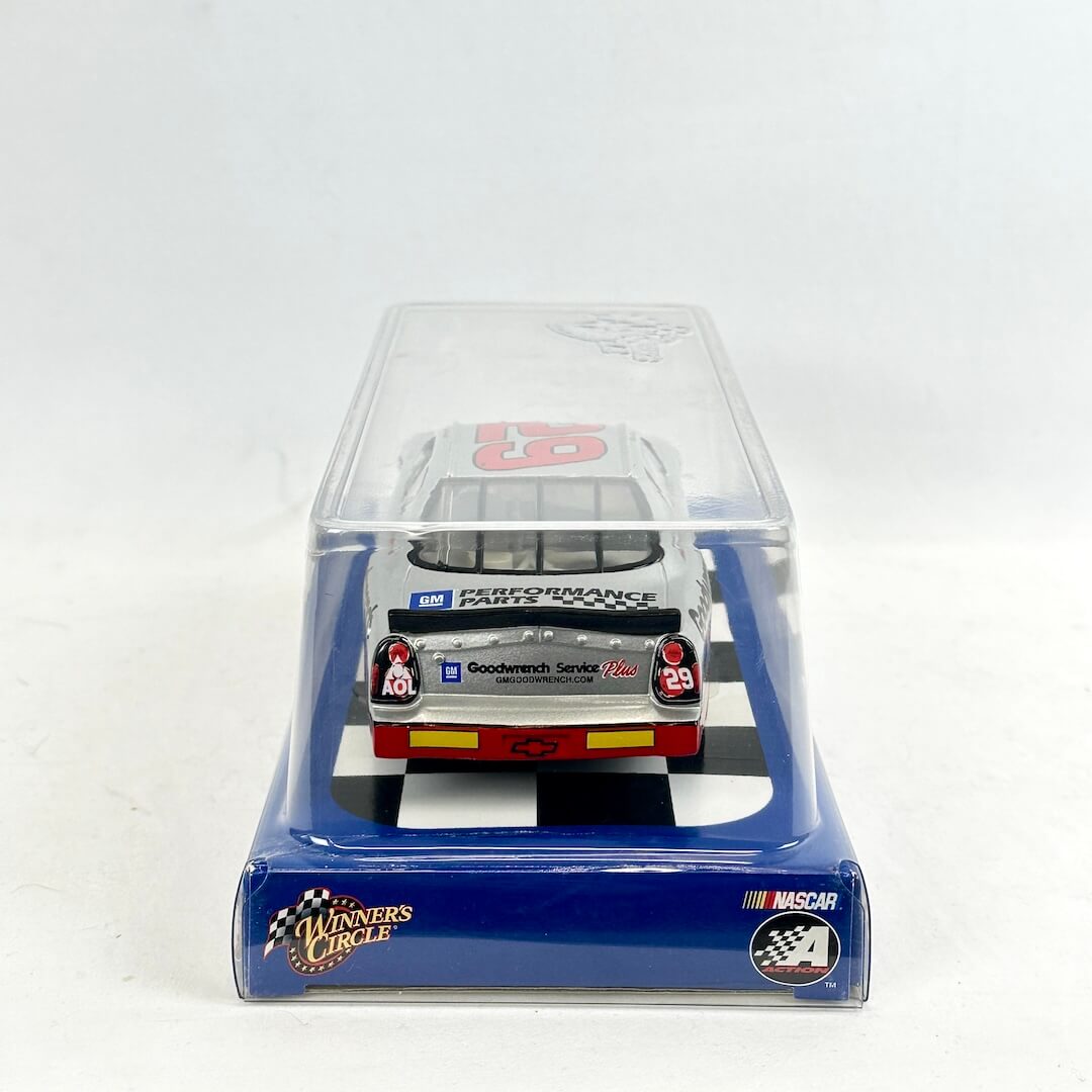 Model car in clear display case with 'Winners Circle' and NASCAR branding on a white background
