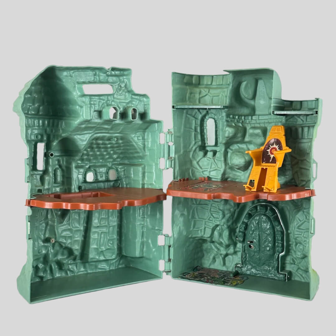 Varying green colored castle with various openings for action figures, & platform to create two levels inside. 